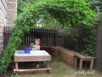 Young girl playing in hideout